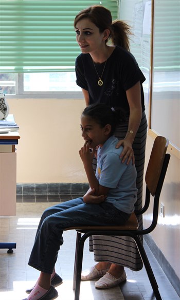 An elementary English teacher leads the class in a fun learning activity at BBS. (Photo: Ashley al-Saliby)